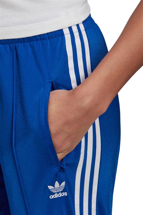 adidas blauw met rode streep traininfsbroek dames|Adidas trainers broek.